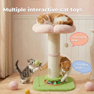 A multi-functional cat tree toy with a pink cushioned perch, beige sisal-wrapped scratching post, green base, and interactive toys, shown with three cats in a cozy room. Text overlays describe the features: 'Multiple interactive cat toys', '2 Hanging balls', and '3 Rolling balls' at Pet Servo