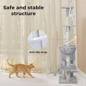 A gray cat tree with multiple perches, a hammock, and a toy, shown next to an orange tabby cat in a room with beige curtains. Text overlays highlight the 'Safe and stable structure' and 'Anti-slip strap' features at Pet Servo