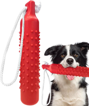 Red dog chew toy with a textured handle and rope, held by a black and white dog at Pet Servo