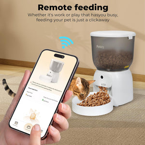 A hand holds a smartphone showing a pet feeder app screen next to a white automatic pet feeder with a bowl of kibble and a cat eating. The scene includes the text 'Remote feeding' and a blue wireless signal icon at Pet Servo