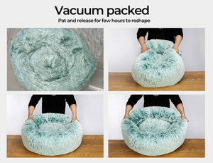 Four-panel collage showing a fluffy round pet bed in a mint green and white marled pattern. The top-left panel shows the product vacuum-packed inside clear plastic wrapping, with text reading 'Vacuum packed' and 'Pat and release for few hours to reshape at Pet Servo