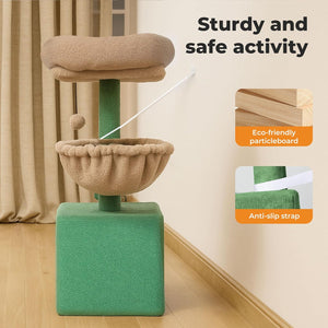 A green and beige cat tree with two cushioned platforms and a ball toy, shown in a room corner with curtains and wood flooring. Text on the image reads 'Sturdy and safe activity' with inset callouts about eco-friendly particleboard and an anti-slip strap at Pet Servo