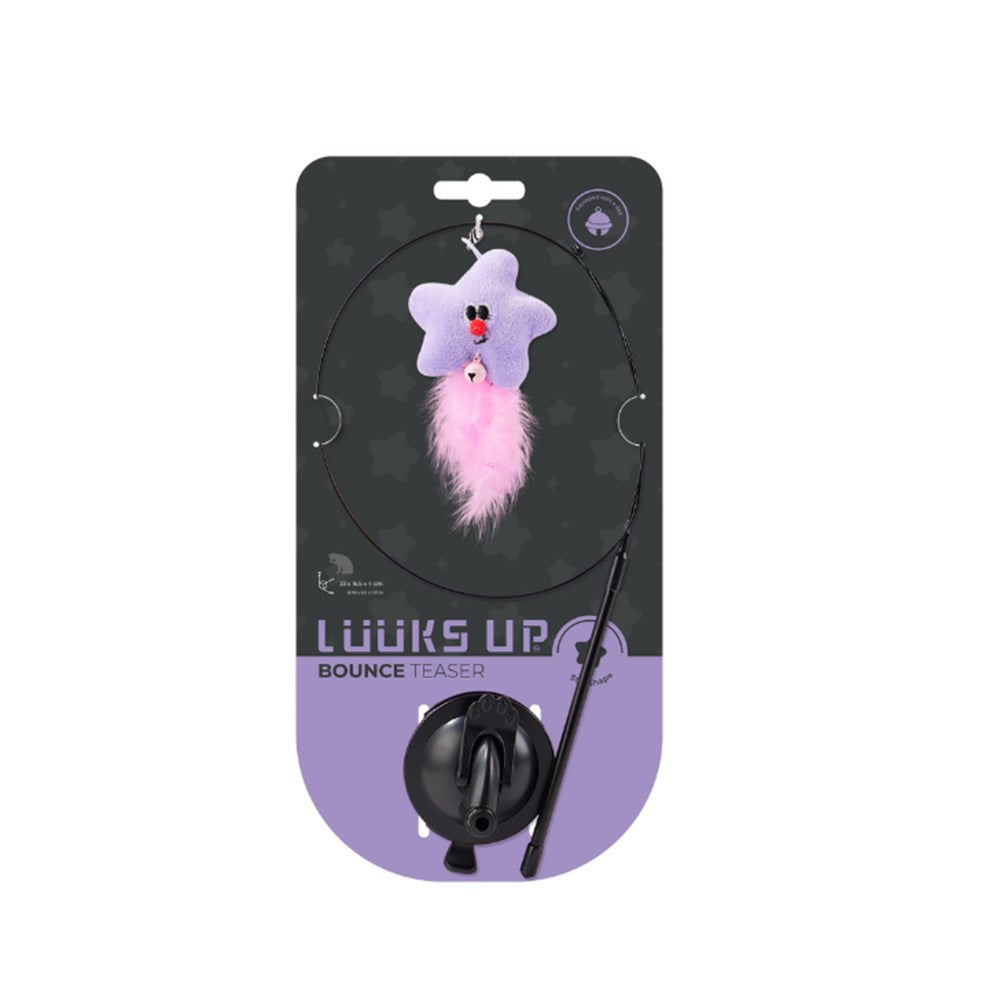 A cat toy package labeled 'LOOKS UP BOUNCE TEASER' showing a black circular rod with a purple star-shaped plush toy and pink fluffy tail, mounted on a black and lavender retail card at Pet Servo