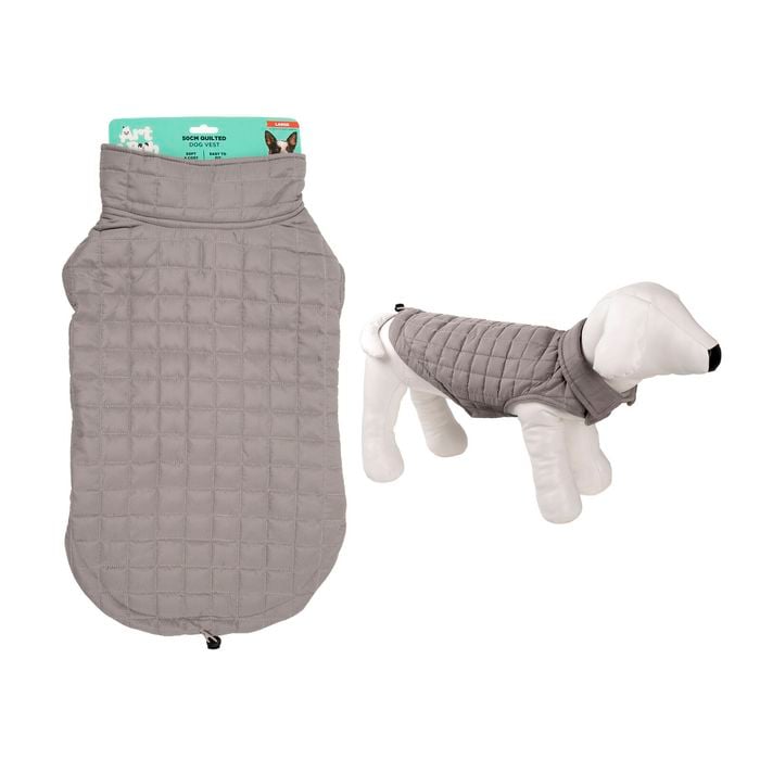 Gray quilted dog coat with a white dog model wearing it on a white background