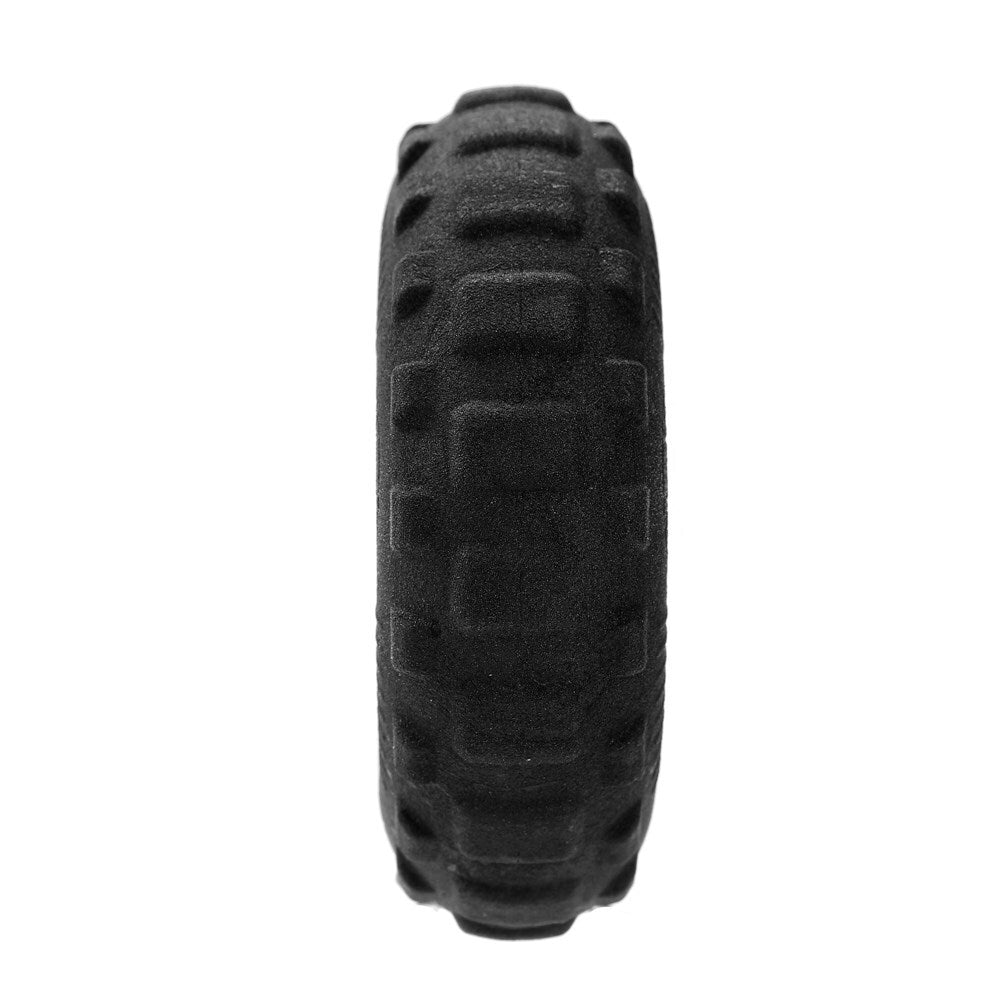 Black tire with tread pattern on a white background at Pet Servo
