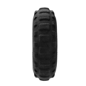 Black tire with tread pattern on a white background at Pet Servo