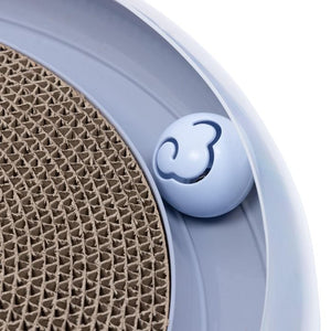 Close-up of a blue pet toy with a textured surface and a brand logo.