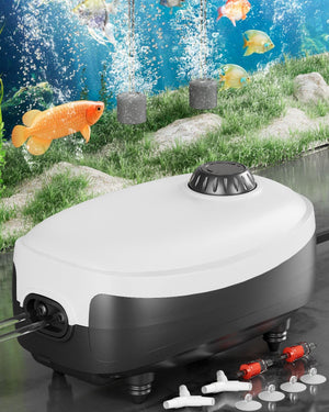 Aquarium air pump with accessories on a reflective surface, fish tank background at Pet Servo