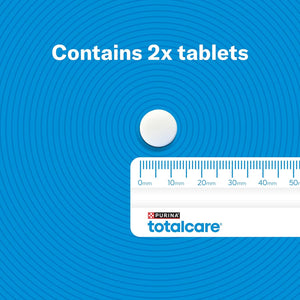 Purina Totalcare tablet with a ruler for scale on a blue background at Pet Servo