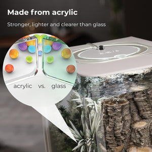 Comparison of acrylic vs glass aquariums with colorful stones and blurred background.
