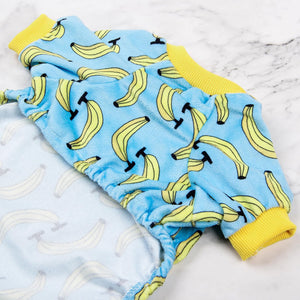 Blue baby pants with banana pattern and yellow cuffs on a light background at Pet Servo