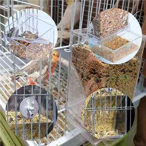 Bird cage with a transparent seed tray and bird seeds inside at Pet Servo