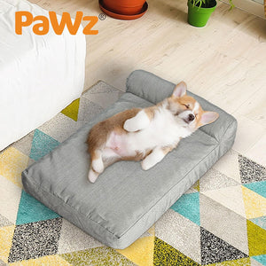 Corgi puppy lying on a gray pet bed with 'PaWz' branding in a home setting at Pet Servo