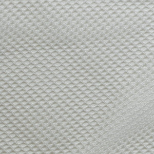 Close-up of a textured light gray fabric with a diamond pattern at Pet Servo