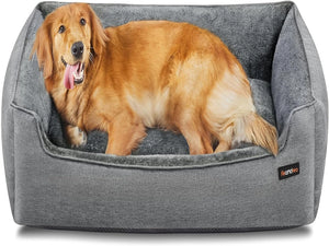 A golden retriever dog lying inside a plush gray pet bed with a raised cushion, shown on a clean white background. A small black Ronda brand tag is visible on the front-right corner of the bed at Pet Servo