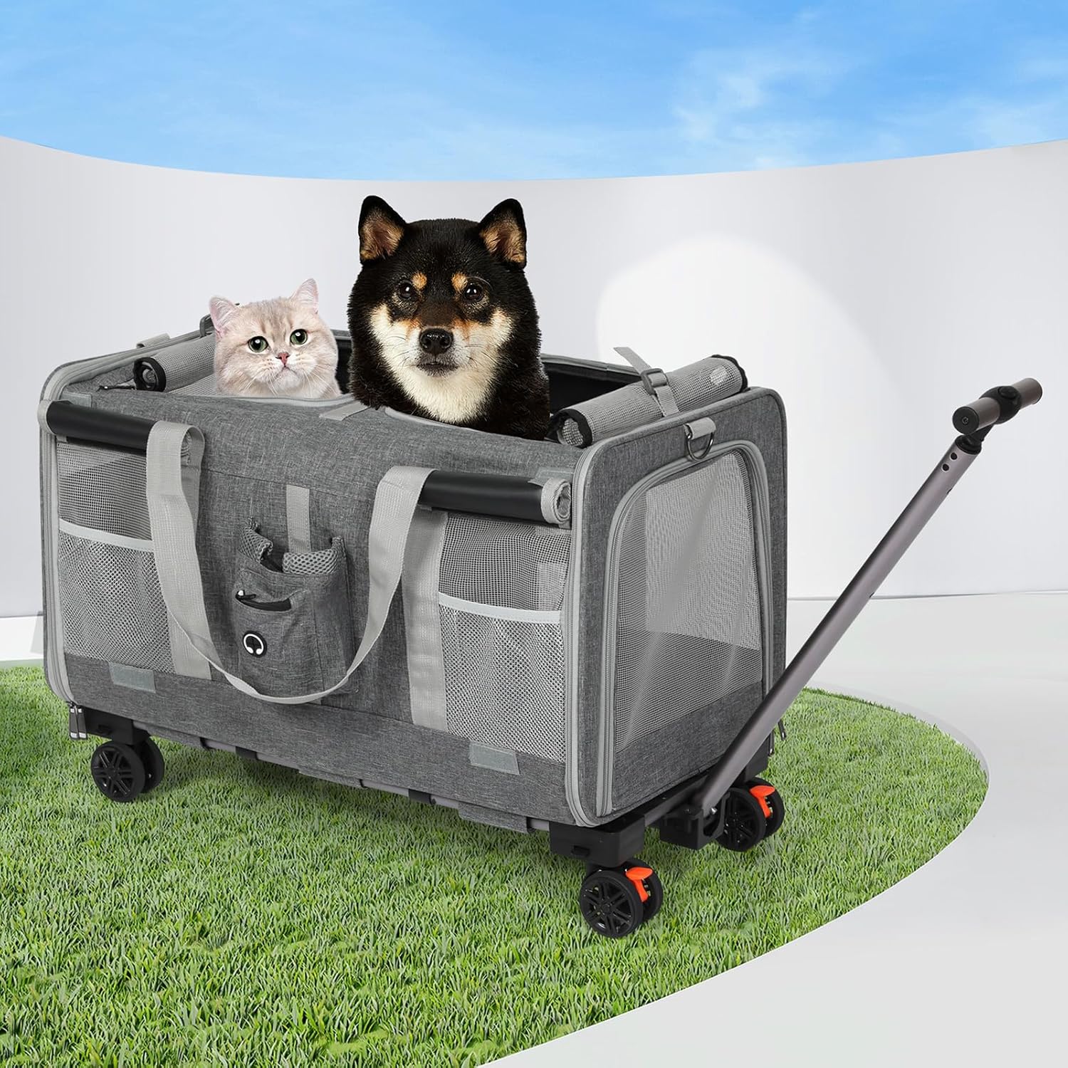 A gray pet stroller with mesh sides and four wheels, shown on a grass-like surface with a white curved backdrop. A black-and-tan dog sits inside the stroller, and a light-colored cat rests on the left side at Pet Servo