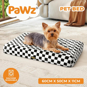 Dog lying on a checkered PaWz pet bed in a living room at Pet Servo