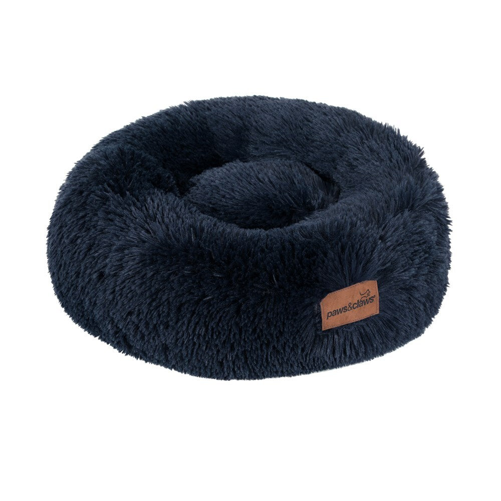 Navy blue fluffy donut pet bed with a brand label on a white background at Pet Servo