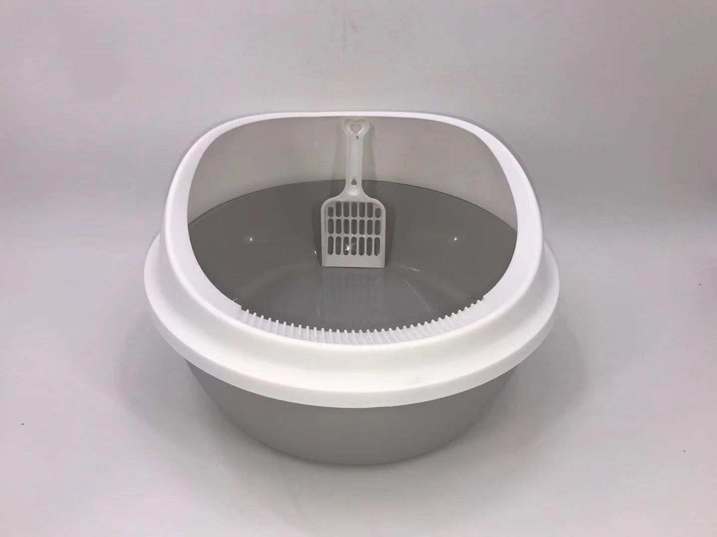 Gray cat litter box with a white scoop on a gray background at Pet Servo