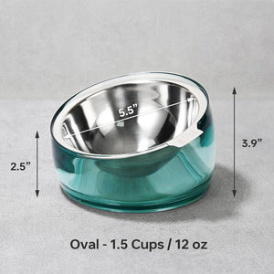 An oval pet bowl with a stainless steel interior and a translucent teal outer base, shown on a gray background with dimension arrows and text indicating 5.5 inches wide, 2 at Pet Servo
