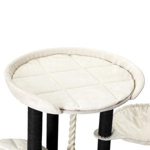 Round cat perch with white cushion and black legs on a white background at Pet Servo