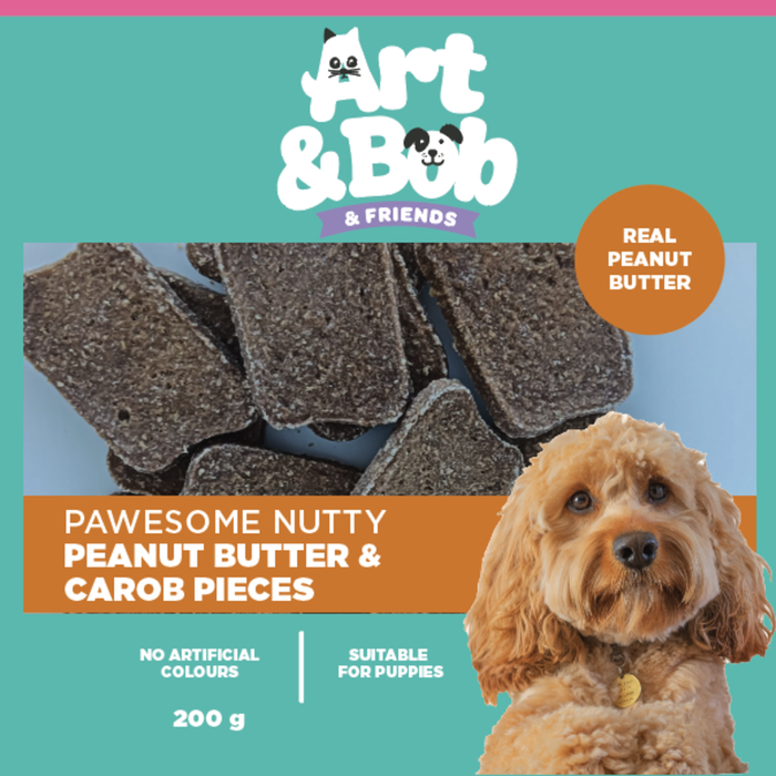 Dog treat package with 'Art & Bob & Friends' branding, featuring peanut butter and carob pieces.