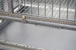 Metal birdcage with a textured surface and visible screws at Pet Servo