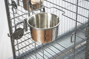 Metallic bowl attached to a wire cage at Pet Servo