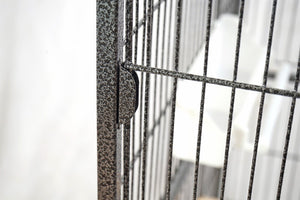 Close-up of a metal gate with a blurred background at Pet Servo