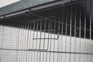 Close-up of a metal grid on a reflective surface at Pet Servo