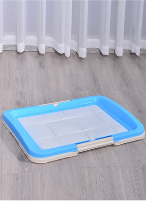 Rectangular pet pad with blue border on a wooden floor at Pet Servo