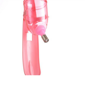 Pink handheld vacuum cleaner on a white background at Pet Servo