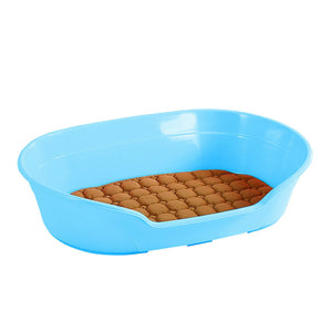 Blue plastic pet litter pan with brown bedding on a white background at Pet Servo
