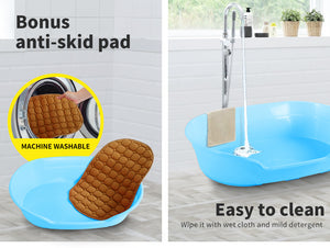 Blue bathtub with anti-skid pad and cleaning instructions on a bathroom floor at Pet Servo