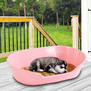 Pink pet bed with a dog on a wooden deck at Pet Servo