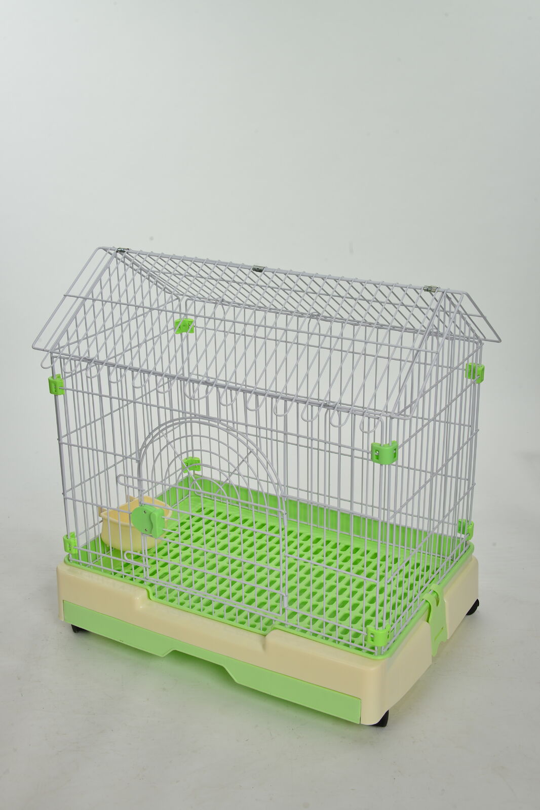Pet cage with green base and white walls on a light gray background at Pet Servo