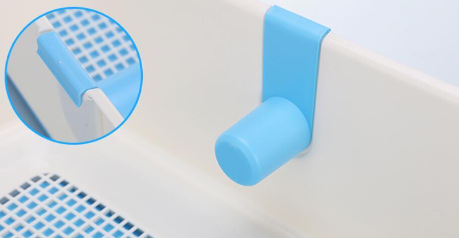 Blue plastic hook on a white surface with a close-up inset showing its texture at Pet Servo