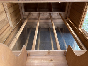 Wooden playhouse interior with slides and steps at Pet Servo