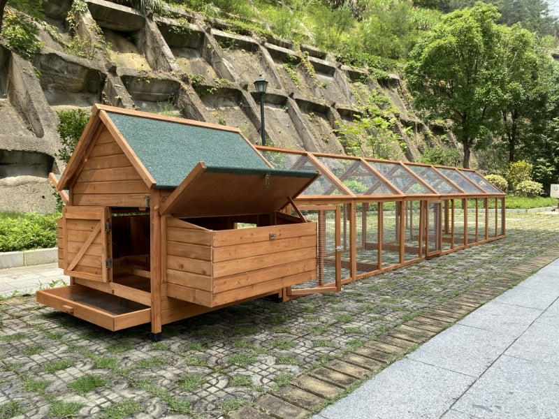 Wooden animal enclosure with a green roof on a stone path at Pet Servo