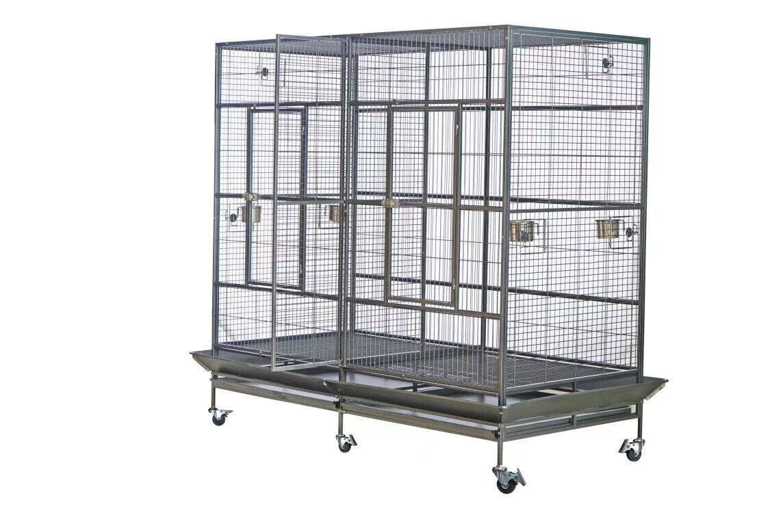 Large metal bird cage on wheels with multiple compartments on a white background at Pet Servo
