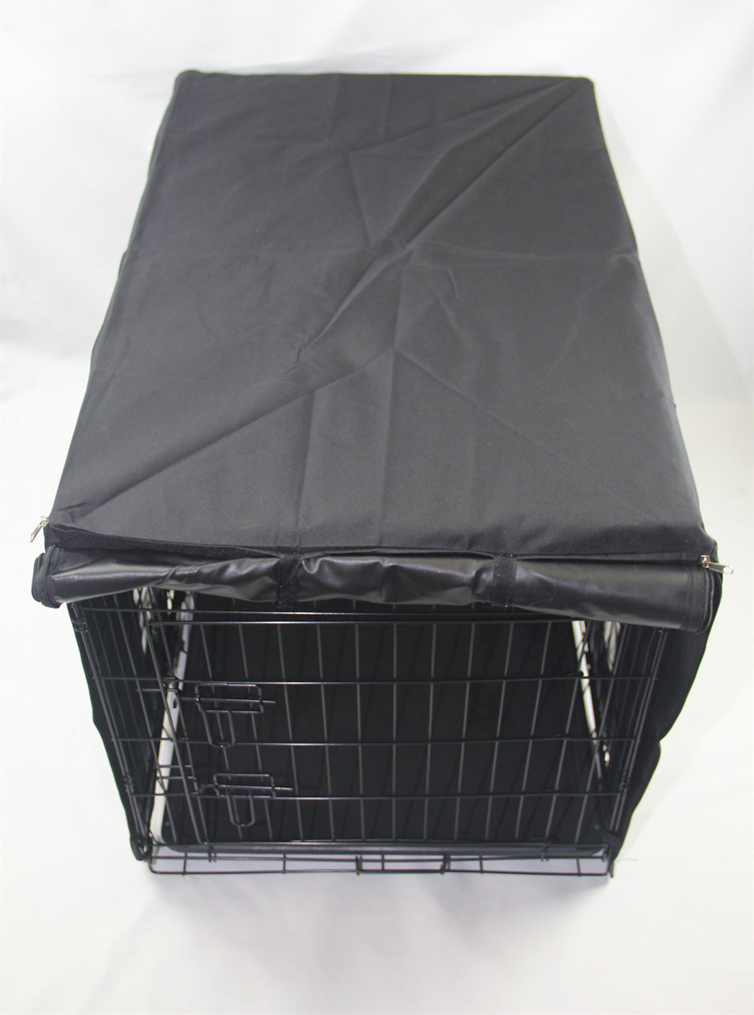 Black wire pet crate with a black cover on a white background at Pet Servo