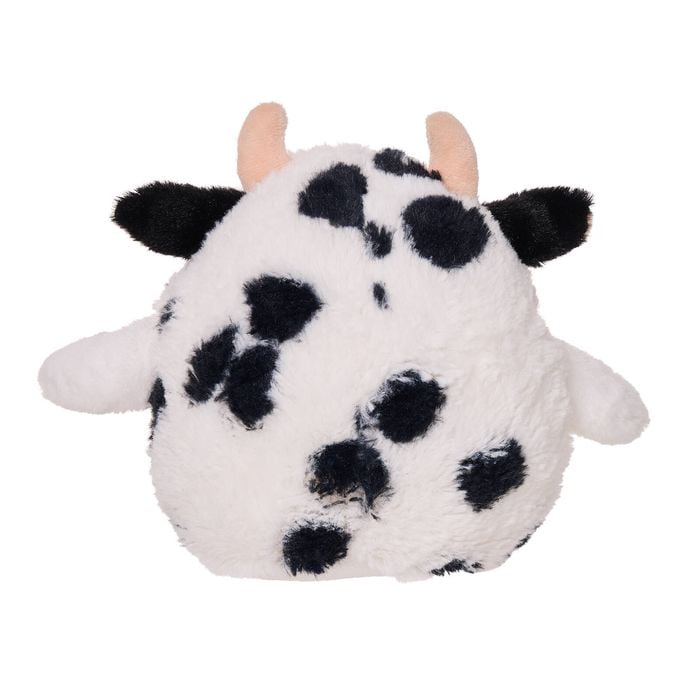 Plush toy shaped like a cow on a white background