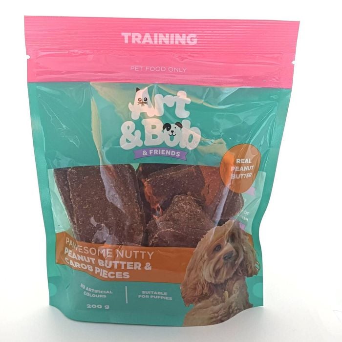 Packaging of Art & Bob & Friends dog treats with peanut butter and carrot pieces on a white background
