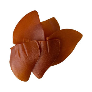 Brown leather flower accessory on a white background