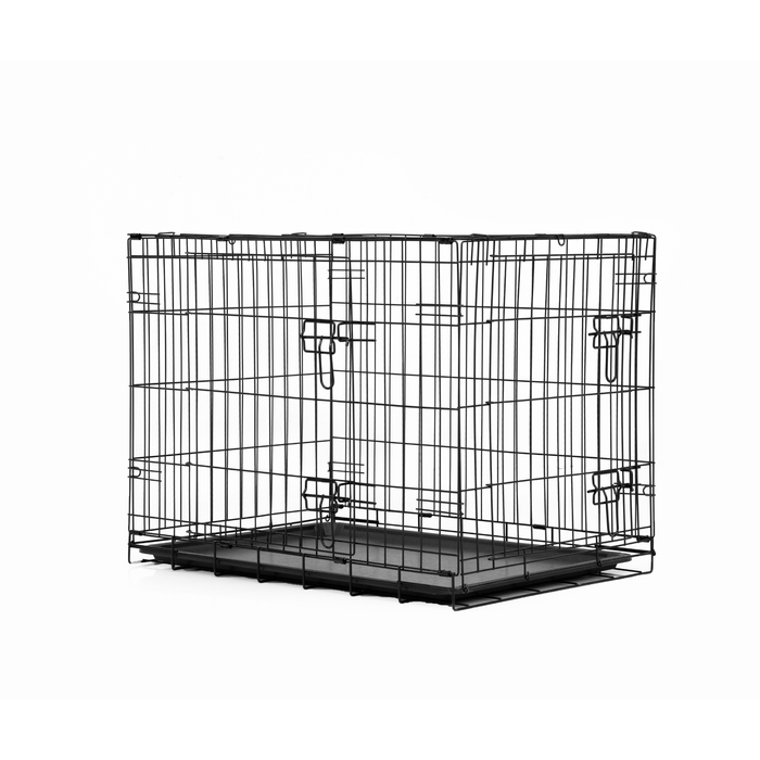 Black metal dog crate on a white background