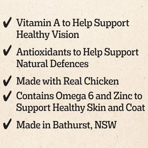 A list of product benefits on a textured beige background, featuring black text with checkmarks: Vitamin A for healthy vision, antioxidants for natural defenses, made with real chicken, Omega 6 and Zinc for healthy skin and coat, and made in Bathurst, NSW.