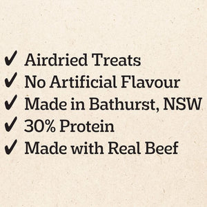 A list of product features on a textured beige background, with black text reading 'Airdried Treats', 'No Artificial Flavour', 'Made in Bathurst, NSW', '30% Protein', and 'Made with Real Beef', each preceded by a checkmark.