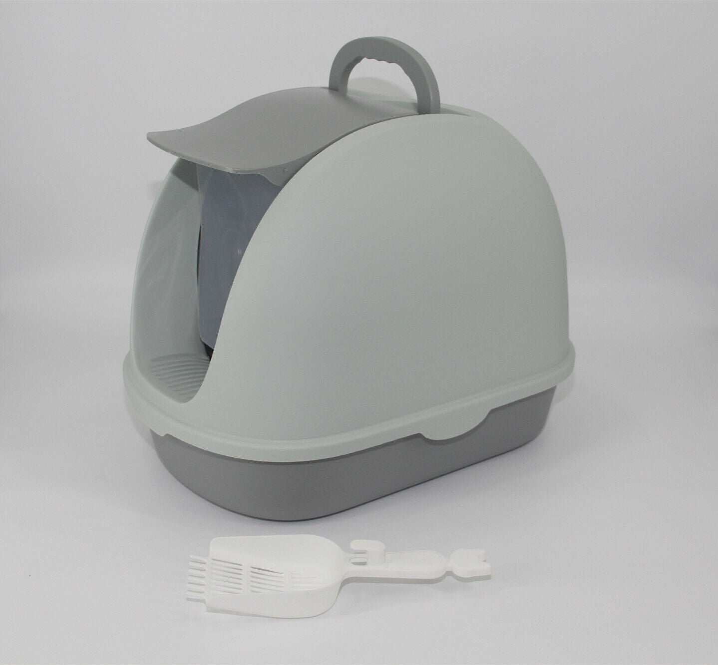 Gray pet litter box with a small white toy on a light gray background at Pet Servo
