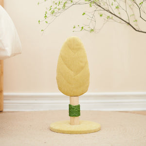 Tree-shaped cat toy with a green base on a beige carpet at Pet Servo
