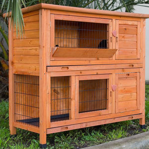 Wooden pet hutch with wire doors on a grassy background at Pet Servo